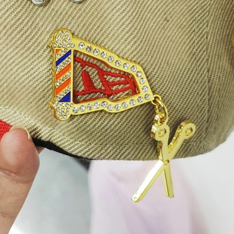 Barber pole cap pin
